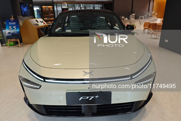 Xiaopeng's first AI car, the P7+, is displayed at its flagship store in Shanghai, China, on November 7, 2024. 