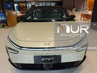 Xiaopeng's first AI car, the P7+, is displayed at its flagship store in Shanghai, China, on November 7, 2024. (