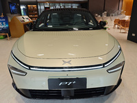 Xiaopeng's first AI car, the P7+, is displayed at its flagship store in Shanghai, China, on November 7, 2024. (