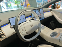 Xiaopeng's first AI car, the P7+, is displayed at its flagship store in Shanghai, China, on November 7, 2024. (