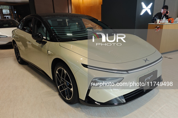 Xiaopeng's first AI car, the P7+, is displayed at its flagship store in Shanghai, China, on November 7, 2024. 