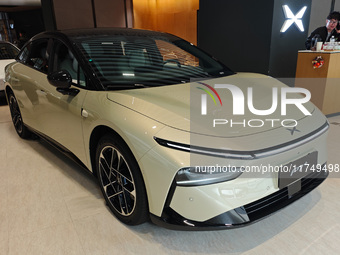 Xiaopeng's first AI car, the P7+, is displayed at its flagship store in Shanghai, China, on November 7, 2024. (