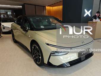 Xiaopeng's first AI car, the P7+, is displayed at its flagship store in Shanghai, China, on November 7, 2024. (