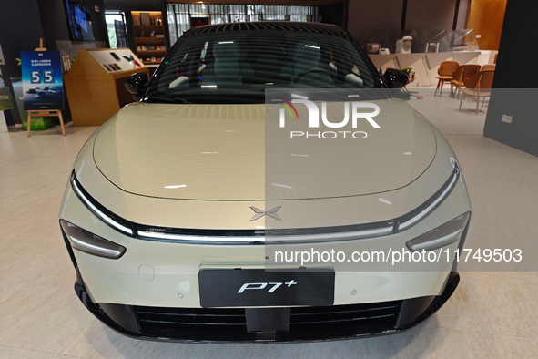 Xiaopeng's first AI car, the P7+, is displayed at its flagship store in Shanghai, China, on November 7, 2024. 