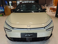 Xiaopeng's first AI car, the P7+, is displayed at its flagship store in Shanghai, China, on November 7, 2024. (