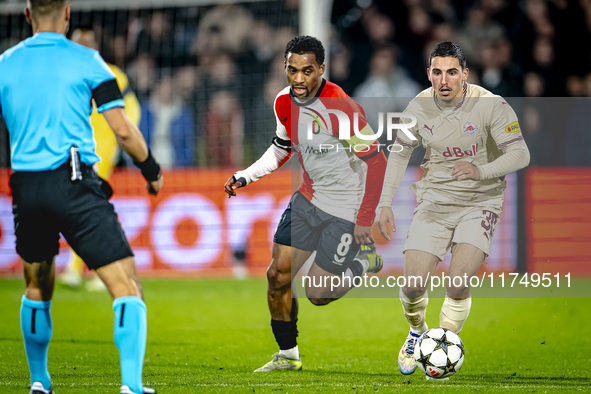 Feyenoord Rotterdam midfielder Quinten Timber and Red Bull Salzburg midfielder Oscar Gloukh play during the match between Feyenoord and Salz...