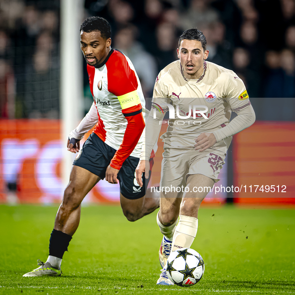 Feyenoord Rotterdam midfielder Quinten Timber and Red Bull Salzburg midfielder Oscar Gloukh play during the match between Feyenoord and Salz...