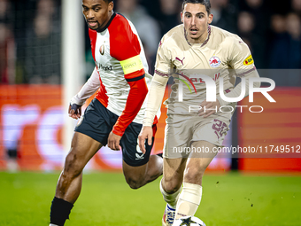 Feyenoord Rotterdam midfielder Quinten Timber and Red Bull Salzburg midfielder Oscar Gloukh play during the match between Feyenoord and Salz...