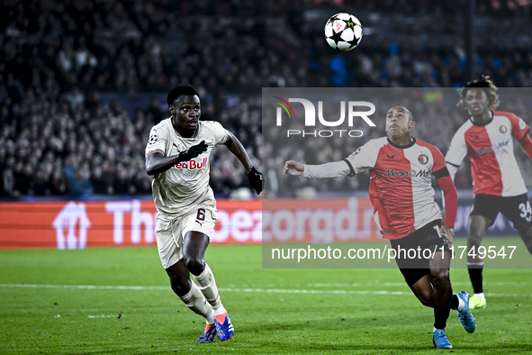 Red Bull Salzburg defender Samson Baidoo and Feyenoord Rotterdam forward Igor Paixao play during the match between Feyenoord and Salzburg at...