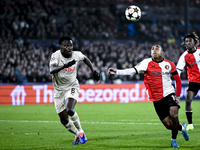 Red Bull Salzburg defender Samson Baidoo and Feyenoord Rotterdam forward Igor Paixao play during the match between Feyenoord and Salzburg at...