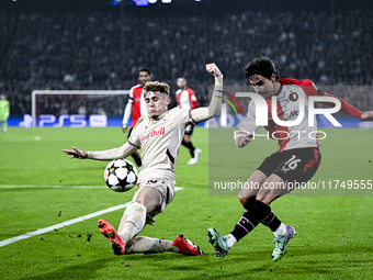 Red Bull Salzburg midfielder Bobby Clark and Feyenoord Rotterdam defender Hugo Bueno play during the match between Feyenoord and Salzburg at...