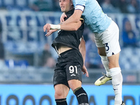 Roberto Piccoli of Cagliari Calcio and Alessio Romagnoli of SS Lazio jump for the ball during the Serie A Enilive match between SS Lazio and...