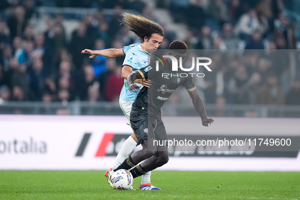 Luca Pellegrini of SS Lazio and Michel Ndary Adopo of Cagliari Calcio compete for the ball during the Serie A Enilive match between SS Lazio...