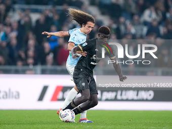 Luca Pellegrini of SS Lazio and Michel Ndary Adopo of Cagliari Calcio compete for the ball during the Serie A Enilive match between SS Lazio...