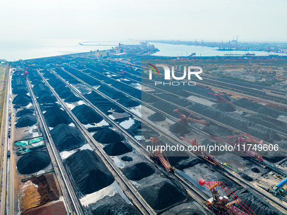 A reclaimer turns over coal at Rizhao Port in Rizhao, China, on November 7, 2024. 