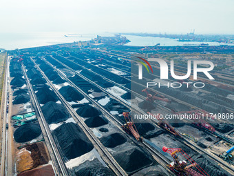 A reclaimer turns over coal at Rizhao Port in Rizhao, China, on November 7, 2024. (