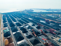 A reclaimer turns over coal at Rizhao Port in Rizhao, China, on November 7, 2024. (