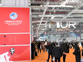 Visitors visit the NACHI exhibition area during the technical equipment exhibition area of the 7th China International Import Expo in Shangh...