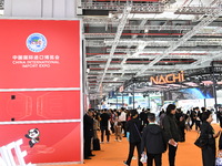 Visitors visit the NACHI exhibition area during the technical equipment exhibition area of the 7th China International Import Expo in Shangh...