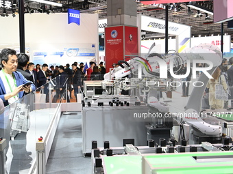 Robots in the fields of industry, medical treatment, science, and technology are displayed in the Technical Equipment Exhibition area of the...