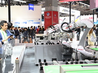 Robots in the fields of industry, medical treatment, science, and technology are displayed in the Technical Equipment Exhibition area of the...