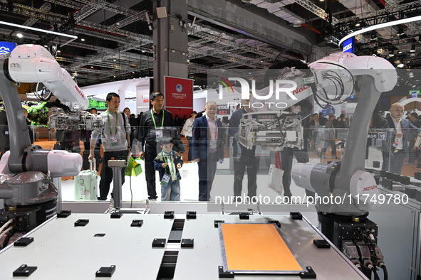 Visitors visit the NACHI exhibition area during the technical equipment exhibition area of the 7th China International Import Expo in Shangh...