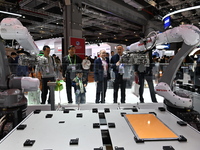 Visitors visit the NACHI exhibition area during the technical equipment exhibition area of the 7th China International Import Expo in Shangh...