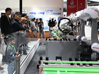 Visitors visit the NACHI exhibition area during the technical equipment exhibition area of the 7th China International Import Expo in Shangh...