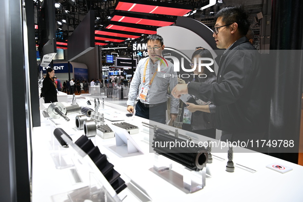 Visitors visit the NACHI exhibition area during the technical equipment exhibition area of the 7th China International Import Expo in Shangh...