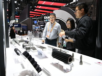 Visitors visit the NACHI exhibition area during the technical equipment exhibition area of the 7th China International Import Expo in Shangh...