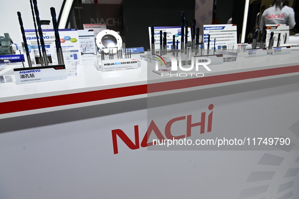 Visitors visit the NACHI exhibition area during the technical equipment exhibition area of the 7th China International Import Expo in Shangh...