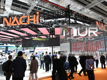 Visitors visit the NACHI exhibition area during the technical equipment exhibition area of the 7th China International Import Expo in Shangh...