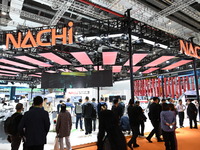 Visitors visit the NACHI exhibition area during the technical equipment exhibition area of the 7th China International Import Expo in Shangh...