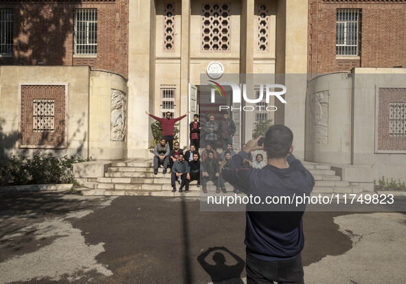 A group of Iranian men takes a selfie while visiting the former U.S. embassy in Tehran, Iran, on November 7, 2024. Former U.S. President and...