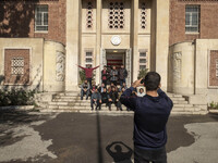 A group of Iranian men takes a selfie while visiting the former U.S. embassy in Tehran, Iran, on November 7, 2024. Former U.S. President and...