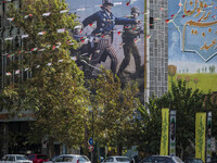 An Iranian taxi driver drives his taxi under an anti-U.S. and Israeli banner in downtown Tehran, Iran, on November 7, 2024. Former U.S. Pres...