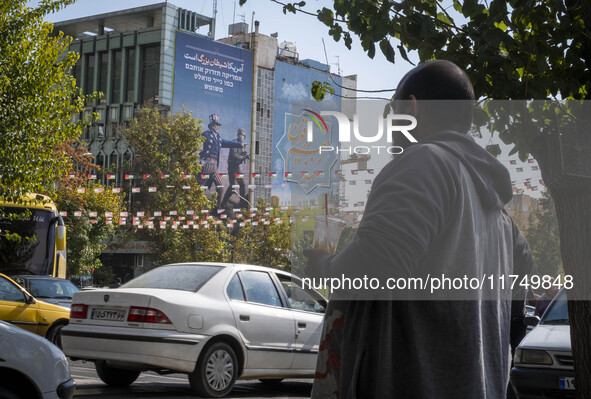 An anti-U.S. and Israeli banner hangs from a wall of a governmental building in downtown Tehran, Iran, on November 7, 2024. Former U.S. Pres...