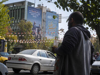 An anti-U.S. and Israeli banner hangs from a wall of a governmental building in downtown Tehran, Iran, on November 7, 2024. Former U.S. Pres...