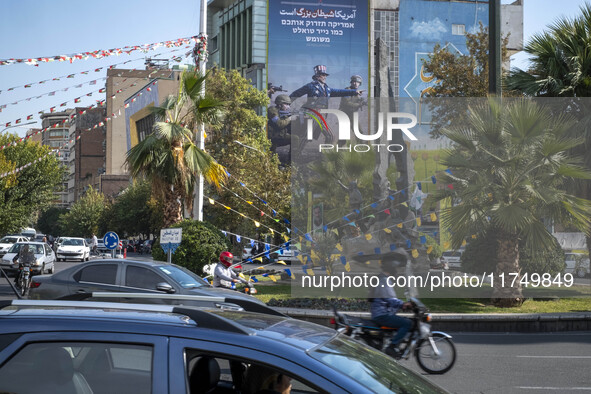 An anti-U.S. and Israeli banner hangs from a wall of a governmental building in downtown Tehran, Iran, on November 7, 2024. Former U.S. Pres...