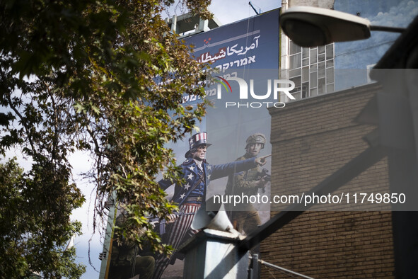 An anti-U.S. and Israeli banner hangs from a wall of a governmental building in downtown Tehran, Iran, on November 7, 2024. Former U.S. Pres...