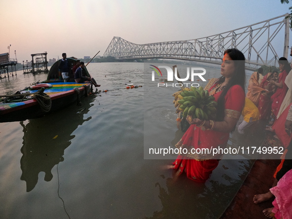 A Hindu devotee offers prayers to the sun god during The Chhath Festival at the Ganga ghat in Kolkata, India, on November 7, 2024. The Chhat...