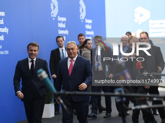 Emmanuel Macron, President of France, arrives with Viktor Orban, Hungarian Prime Minister, at the 5th European Political Community Summit in...