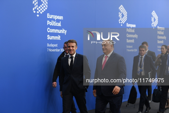 Emmanuel Macron, President of France, arrives with Viktor Orban, Hungarian Prime Minister, at the 5th European Political Community Summit in...