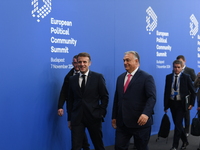 Emmanuel Macron, President of France, arrives with Viktor Orban, Hungarian Prime Minister, at the 5th European Political Community Summit in...