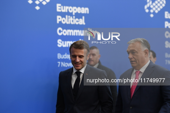 Emmanuel Macron, President of France, arrives with Viktor Orban, Hungarian Prime Minister, at the 5th European Political Community Summit in...