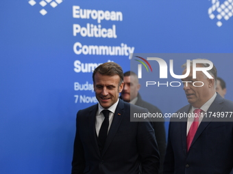 Emmanuel Macron, President of France, arrives with Viktor Orban, Hungarian Prime Minister, at the 5th European Political Community Summit in...