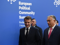 Emmanuel Macron, President of France, arrives with Viktor Orban, Hungarian Prime Minister, at the 5th European Political Community Summit in...