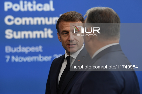 Emmanuel Macron, President of France, arrives with Viktor Orban, Hungarian Prime Minister, at the 5th European Political Community Summit in...