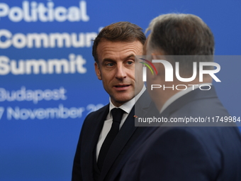 Emmanuel Macron, President of France, arrives with Viktor Orban, Hungarian Prime Minister, at the 5th European Political Community Summit in...