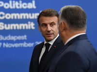 Emmanuel Macron, President of France, arrives with Viktor Orban, Hungarian Prime Minister, at the 5th European Political Community Summit in...